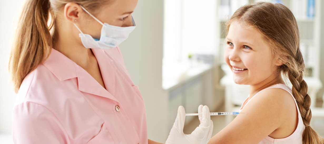 nurse-injecting-smiling-girl